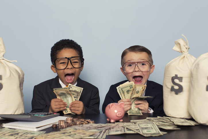 Young Business Children Make Faces Holding Lots of Money